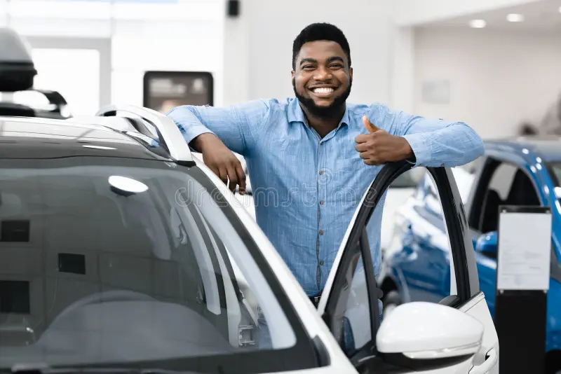 guy-standing-near-auto-gesturing-thumbs-up-dealership-center-great-car-cheerful-african-american-guy-standing-near-auto-173734707